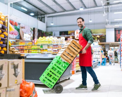 Portrait of supermarket stocker working